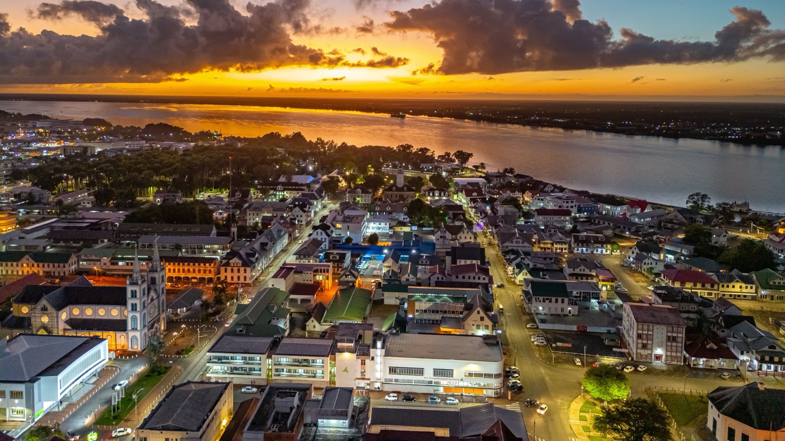 Aerial view of Paramaribo's historic centre and the Suriname River at sunset