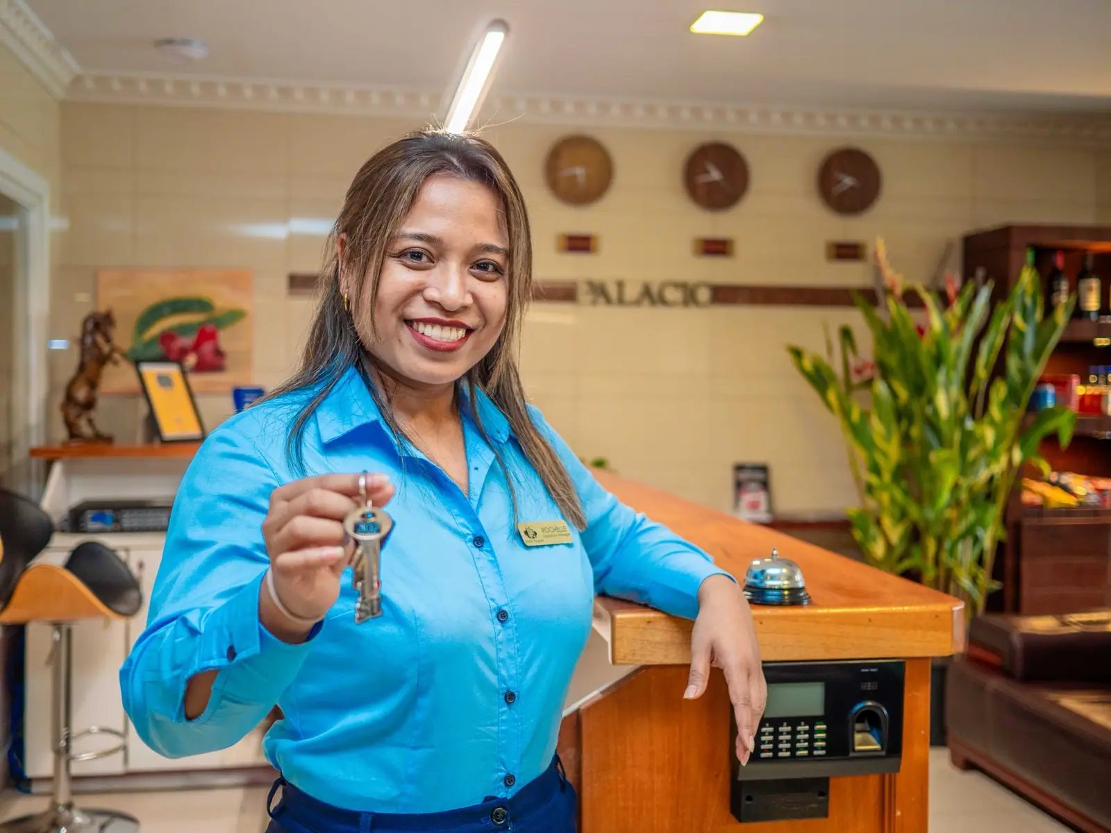 Friendly front desk staff welcoming guests at Hotel Palacio
