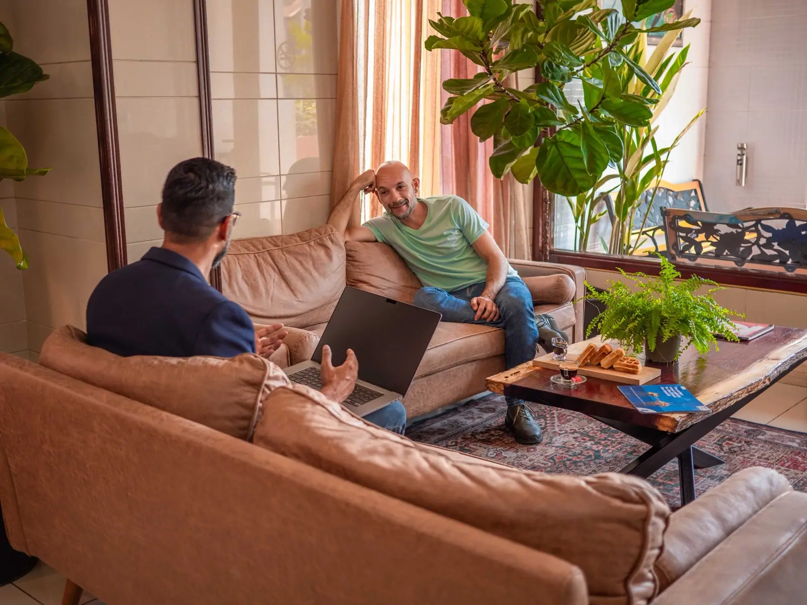 Guests and staff chatting in the Hotel Palacio lobby